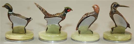 A set of four cold painted bronze menu holders, largest 1.5in.